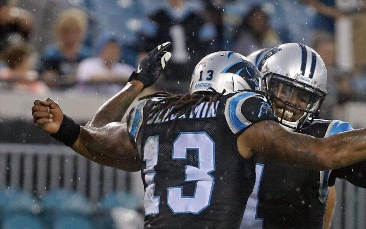 Carolina Panthers quarterback Cam Newton (1) celebrates after throwing a pass for a touchdown to wide receiver Kelvin Benjamin (13) during the first half of Thursday’s preseason game against the Jacksonville Jaguars.