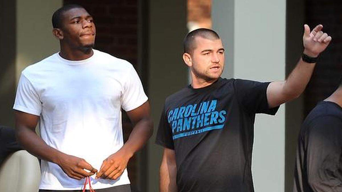 
Rookie wide receiver Devin Funchess, center, is directed to other buildings on the campus of Wofford College in Spartanburg, where the Carolina Panthers will hold their first training camp practice on Friday. 
