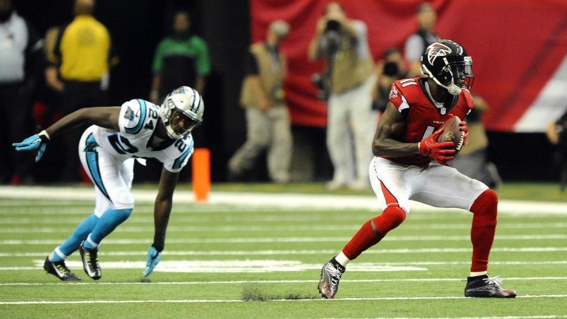 Atlanta Falcons wide receiver Julio Jones (11) makes a reception in front of Carolina Panthers cornerback James Bradberry (24) during the second half at the Georgia Dome in Atlanta, Ga. on Sunday, October 2, 2016. Atlanta won 48-33.