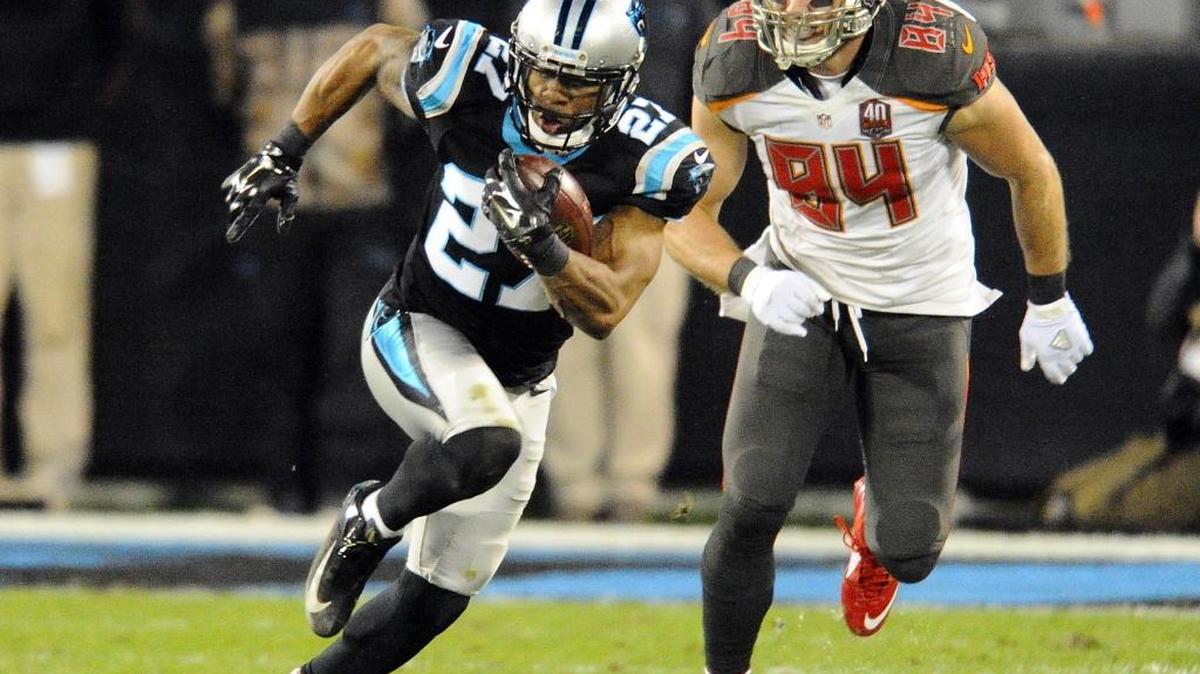 Carolina Panthers' Robert McClain (27) heads upfield after intercepting a pass intended for Tampa Bay Buccaneers' Cameron Brate (84) in the fourth quarter of Sunday’s game. The Panthers won 38-10, and secured home field through the playoffs.