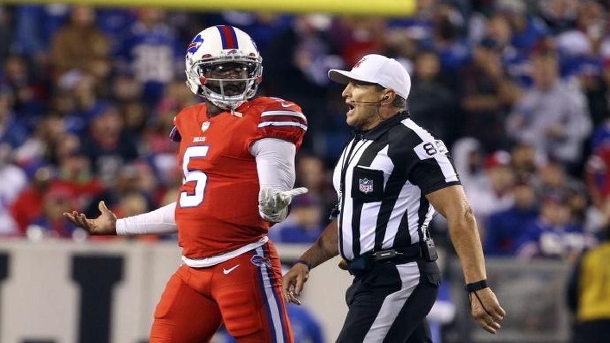 Buffalo Bills quarterback Tyrod Taylor (5) is walked off the field by referee Ed Hochuli for a concussion check in September. The NFL says awareness of concussions is on the rise.