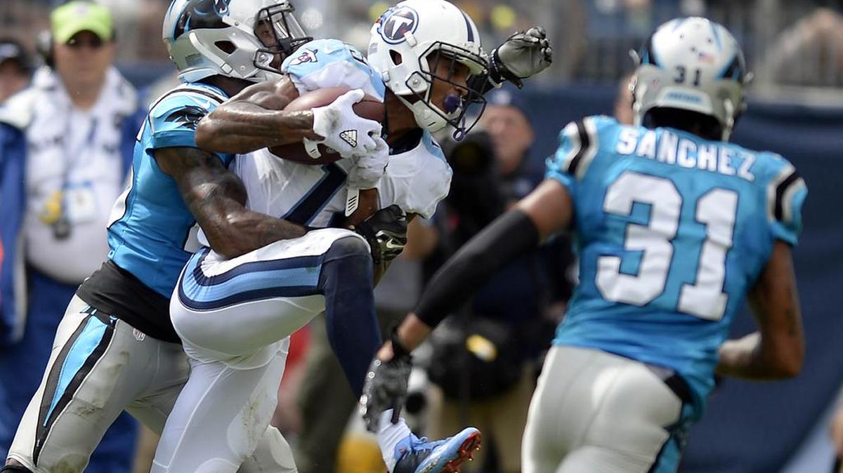 Tennessee Titans wide receiver Tajae Sharpe (19) make a completion between Carolina Panthers cornerback Daryl Worley (26) and cornerback Zack Sanchez (31) in the first half at Nissan Stadium in Nashville, TN during their pre-season game on Saturday, August 20, 2016. The Panthers won 26-16.