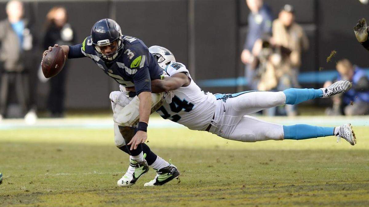 Carolina Panthers cornerback Josh Norman (24) stretches to sack Seattle Seahawks quarterback Russell Wilson (3) in the third quarter on Sunday. After leading by 31 at the half, the Panthers won 31-24.