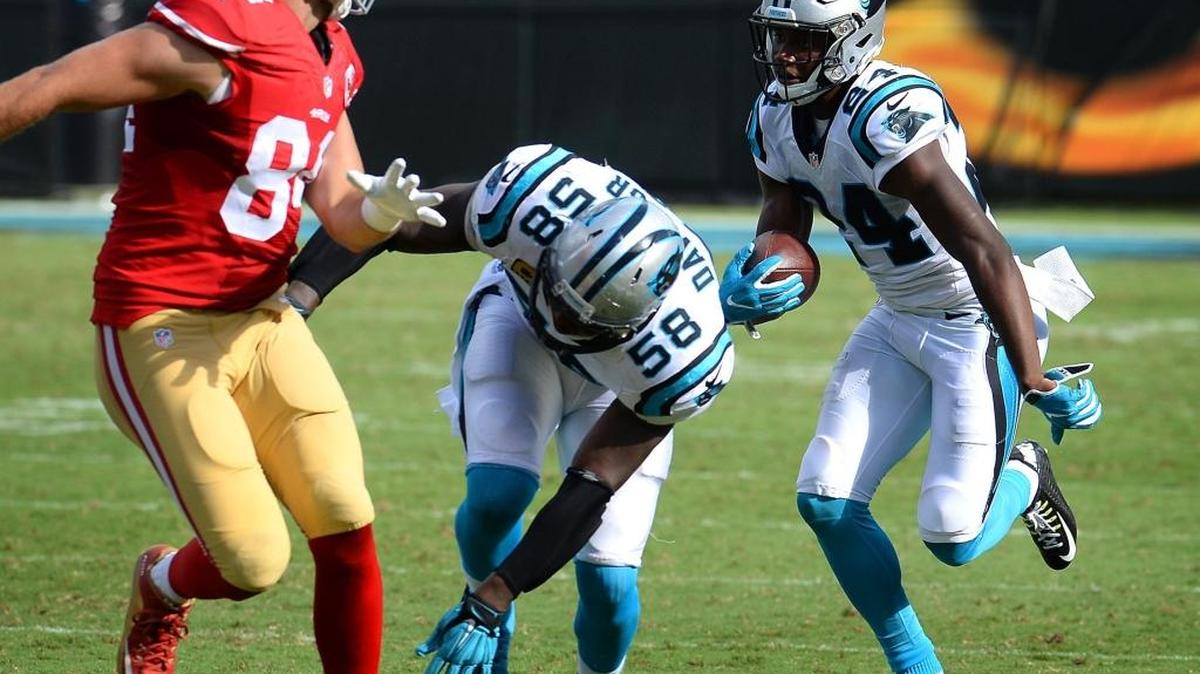 Carolina Panthers cornerback James Bradberry, right, returns a pass by San Francisco 49ers quarterback Blaine Gabbert that he intercepted late in the fourth quarter on Sunday. The Panthers defeated the 49ers 46-27.