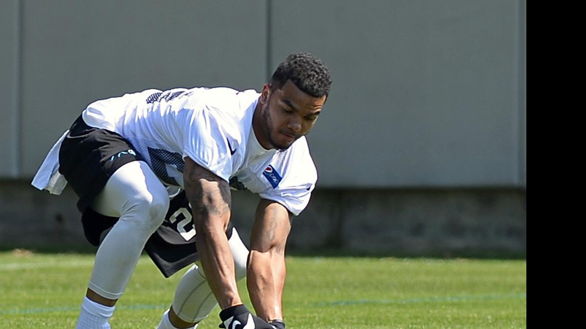 
Carolina Panthers safety Dean Marlowe reaches down to retrieve a football during the team's rookie minicamp on Friday, May 8, 2015.
