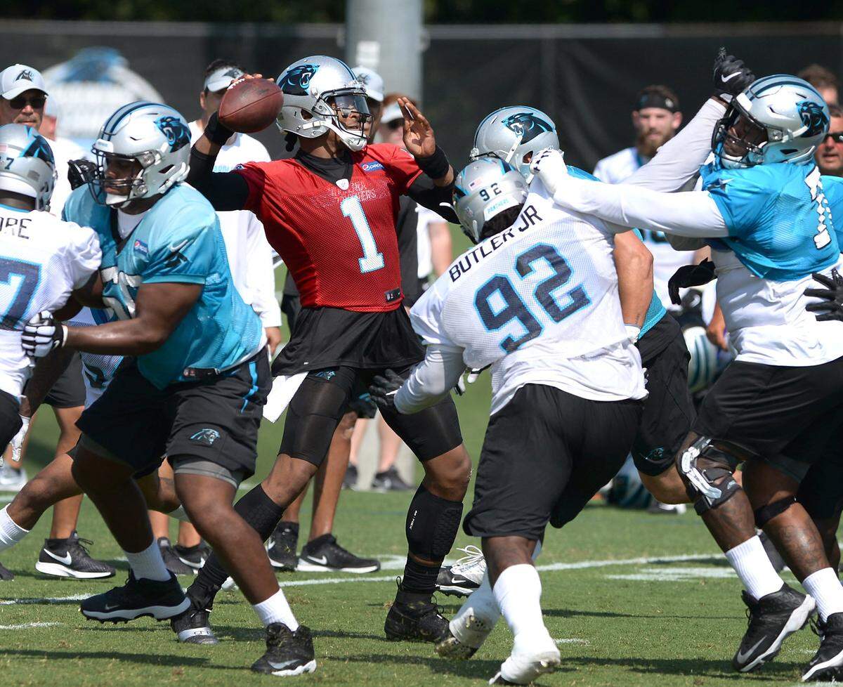 Carolina Panthers quarterback Cam Newton, center, stands in the pocket to pass during the team’s second training camp practice on Friday, July 27, 2018. The Panthers are holding training camp at Wofford College in Spartanburg, SC.