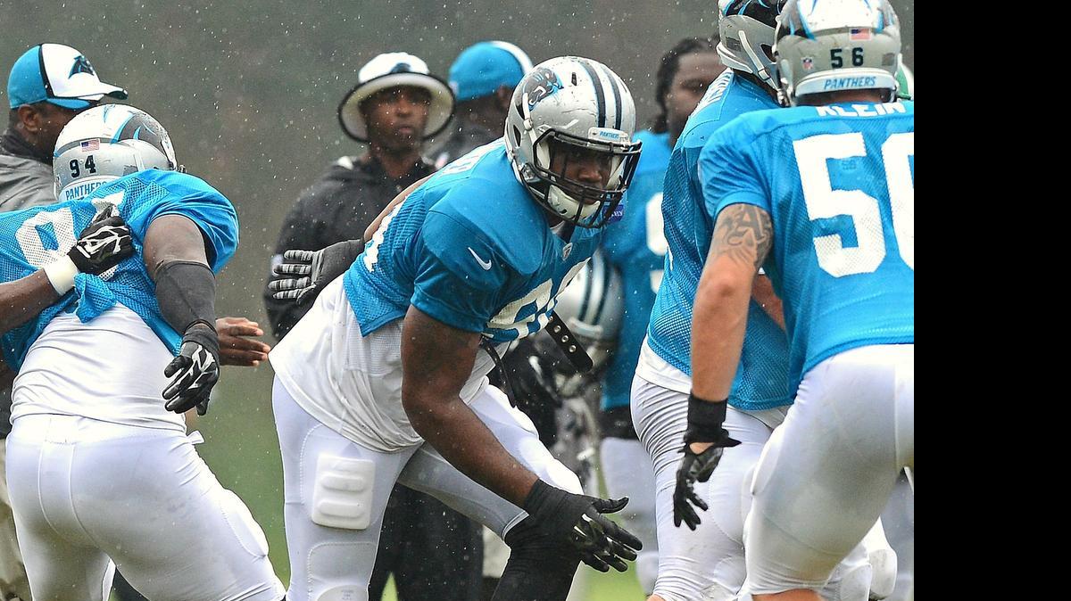 
(Center) Carolina Panthers defensive end Frank Alexander (90) breaks through the line during practice at Wofford College in Spartanburg, SC on Thursday, July 31, 2014. 
