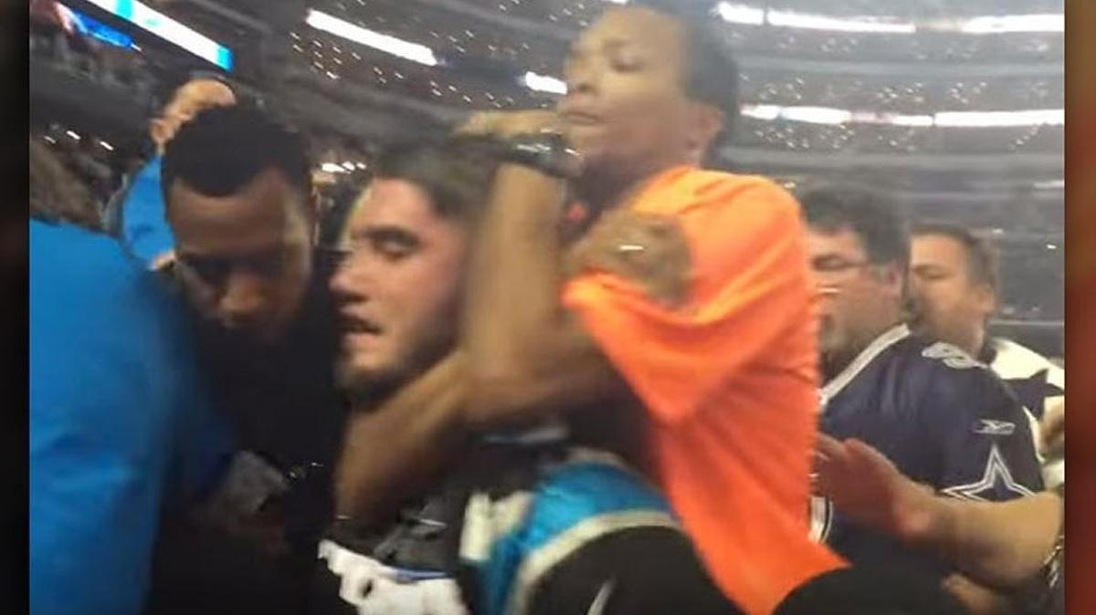 In a lawsuit, Panthers fan John Small claims he wasn’t violating Cowboys Stadium policies when he was put in a ‘sleeper hold’ by a security guard.