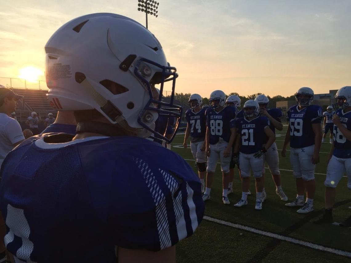A Cincinnati St. Xavier player wears the Q Collar, which might help protect contact athletes from concussions. Studies of the experimental device have been promising.