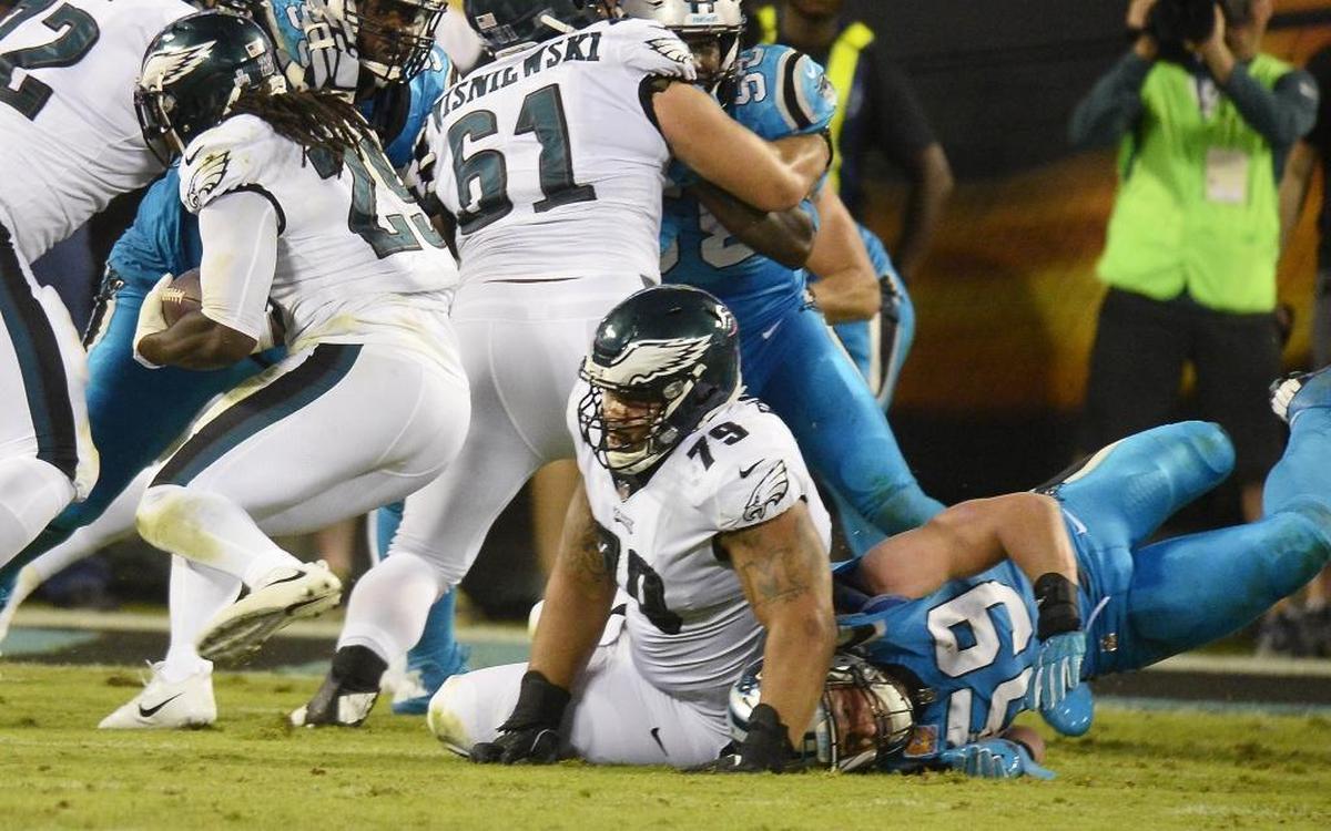 Carolina Panthers middle linebacker Luke Kuechly (59) left in the second quarter of Thursday’s game against the Eagles after the side of his helmet struck the shoulder of Philadelphia pulling guard Brandon Brooks.