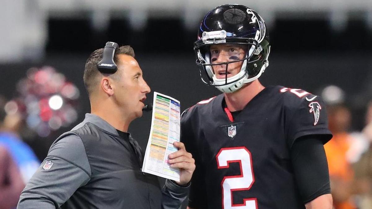 Atlanta Falcons offensive coordinator Steve Sarkisian confers with quarterback Matt Ryan (2) on the sideline on Oct. 1. Sarkisian is in his first season with the Falcons.