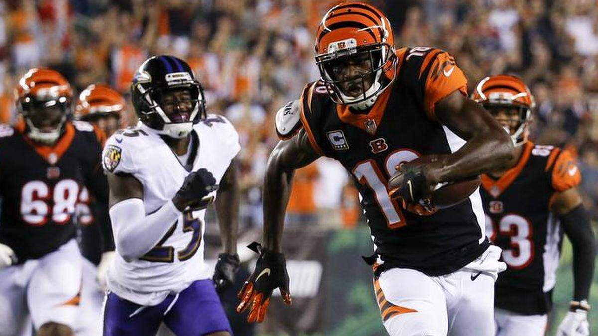 Cincinnati Bengals receiver A.J. Green, right, races to the end zone for one of this three touchdowns in the Bengals’ 34-23 victory over Baltimore last Thursday.