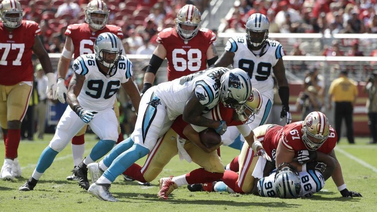Carolina Panthers defensive end Julius Peppers (90) has 6.5 sacks this season, including this one against San Francisco 49ers quarterback Brian Hoyer in the season opener.