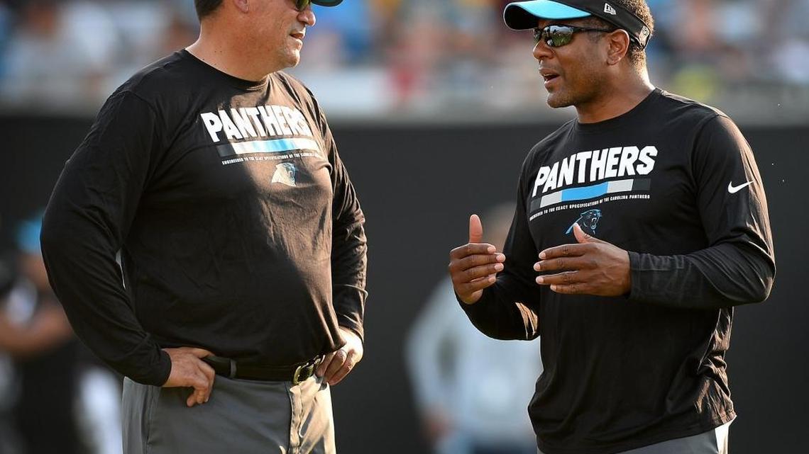 Carolina Panthers coach Ron Rivera, left, promoted Steve Wilks, right, to defensive coordinator two days after Sean McDermott was hired as Buffalo’s head coach.