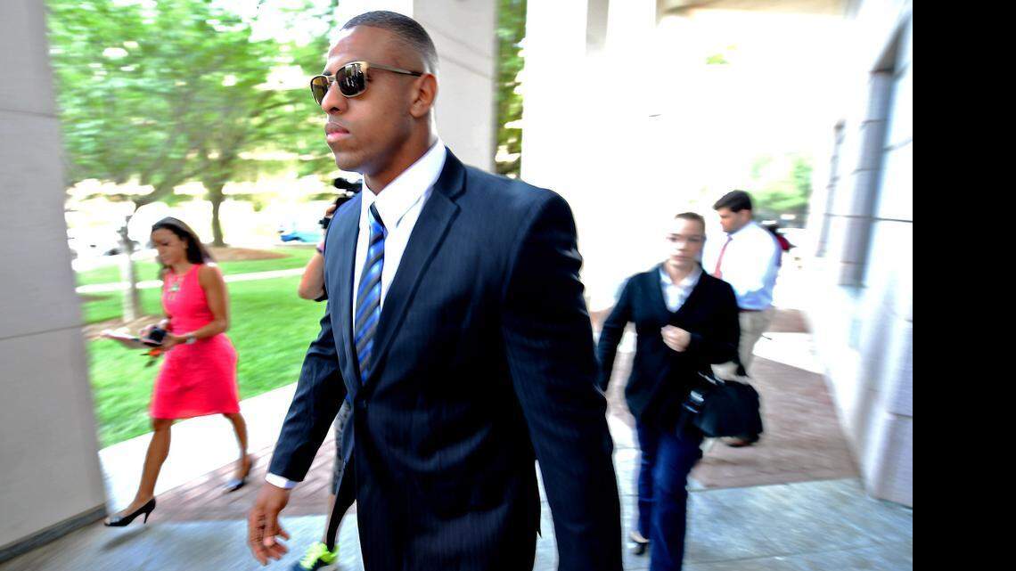 
Former Carolina Panthers defensive end Greg Hardy walks into the Mecklenburg County Courthouse July 15, 2014.
