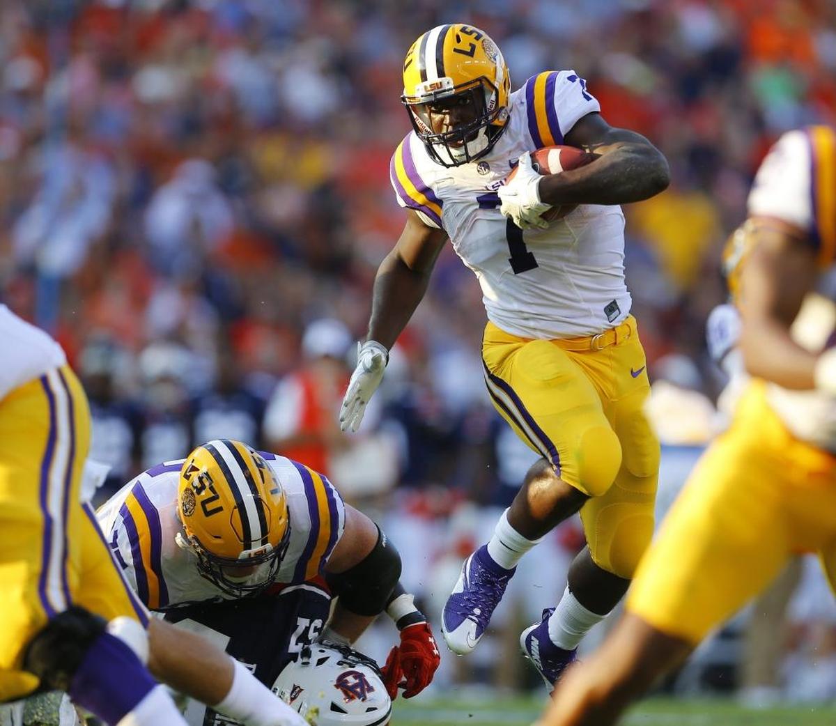 FILE - In this Sept. 24, 2016, file photo, LSU running back Leonard Fournette (7) hurdles an Auburn player as he carries the ball during the first half of an NCAA college football game, in Auburn, Ala.