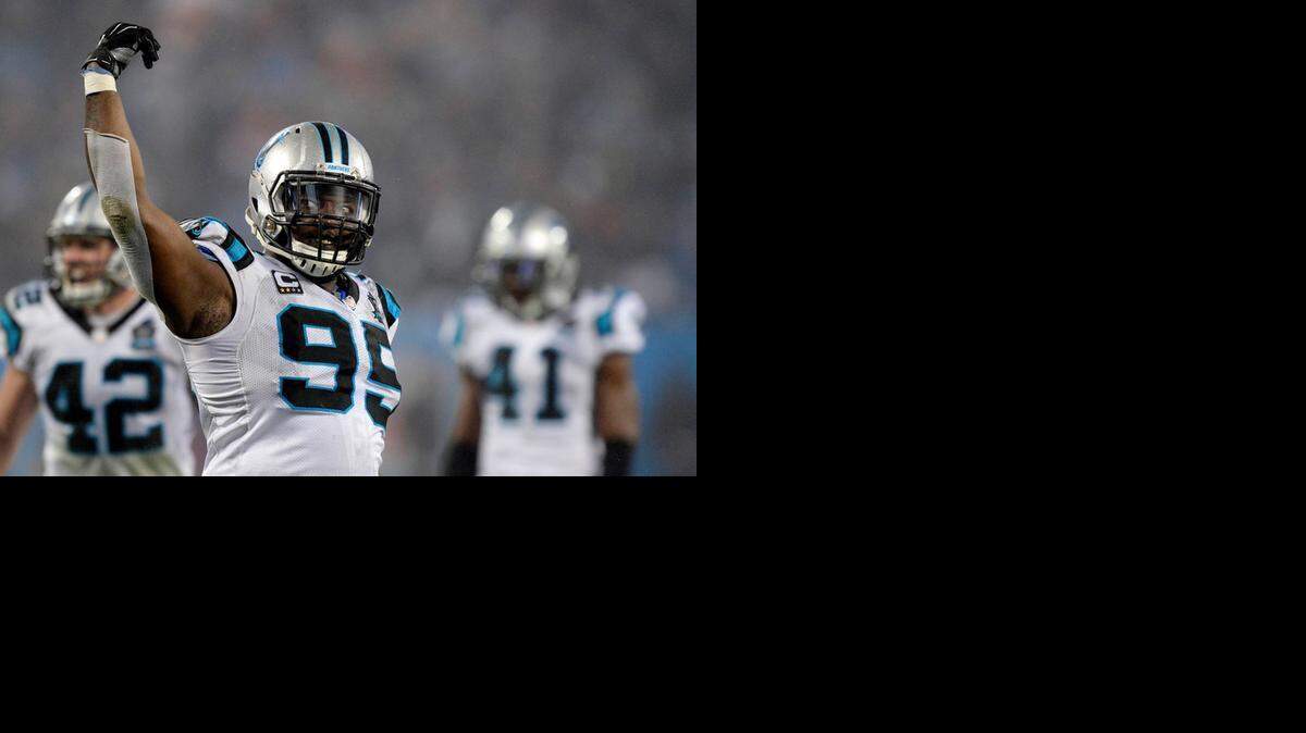 
Carolina Panthers defensive lineman Charles Johnson (95) calls for more noise from the crowd against the Arizona Cardinals in the second half of their NFL playoff game at Bank of America Stadium on  Jan. 3, 2015. The Panthers won 27-16.
