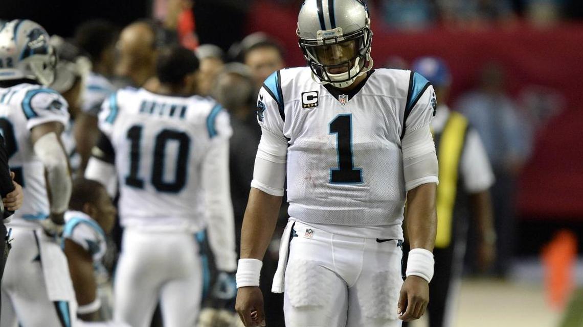 Carolina Panthers quarterback Cam Newton (1) walks the sideline after a sack-fumble late in the game against the Atlanta Falcons at the Georgia Dome on Sunday. The Falcons won 20-13, spoiling the Panthers bid for an undefeated season.
