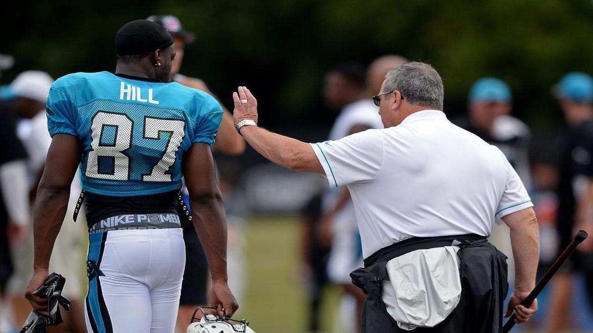 Carolina Panthers general manager Dave Gettleman, right, talks with receiver Stephen Hill during an early August practice at Wofford in Spartanburg. The Panthers cut Hill on Sunday.