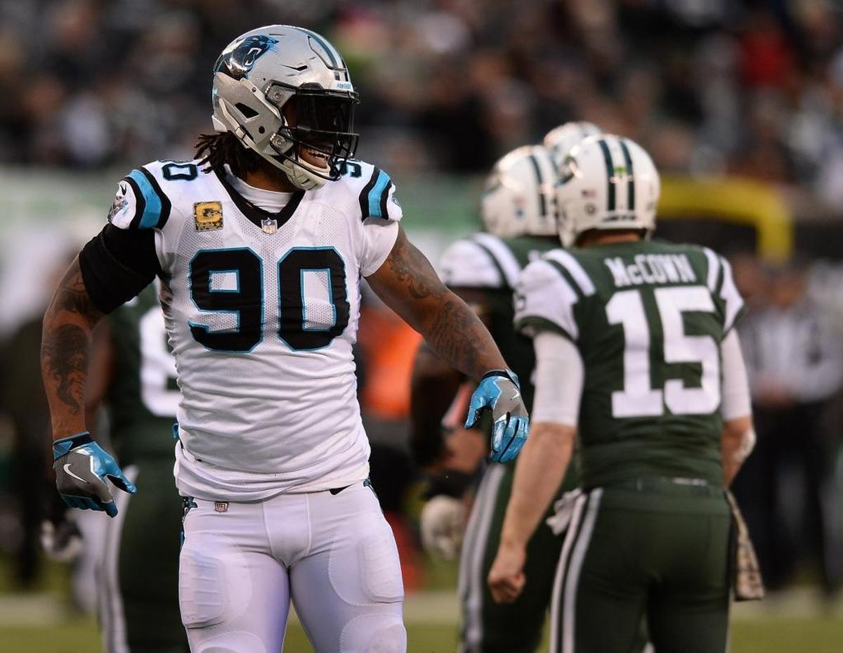 Carolina Panthers defensive end Julius Peppers (90) becomes a bigger key with teammate Charles Johnson suspended for four games.