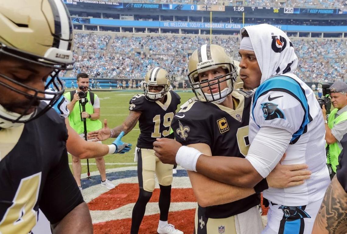 Carolina Panthers quarterback Cam Newton (1) might be more physically talented than New Orleans Saints quarterback Drew Brees (9), but does he draw as much out of his teammates?
