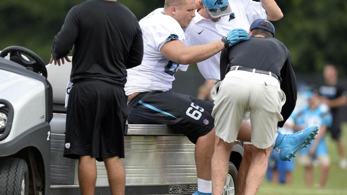 Carolina Panthers defensive tackle Chas Alecxih (65) is helped to a cart after being injured during a drill at training camp at Wofford College on Sunday.