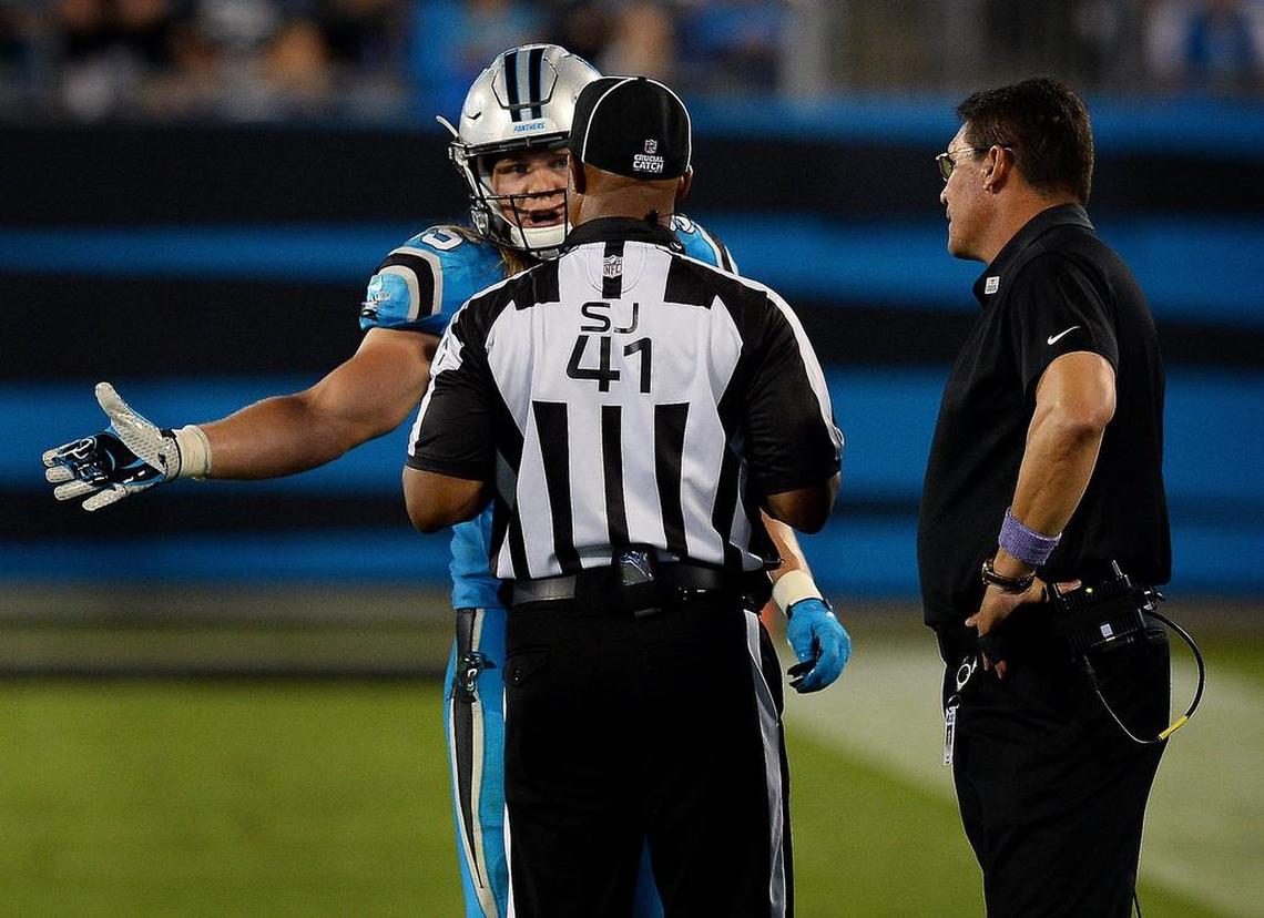 Carolina Panthers linebacker David Mayo, discusses a call with side judge Boris Cheek, center, as head coach Ron Rivera, right, listens during third quarter action against the Philadelphia Eagles on Thursday, October 12, 2017 at Bank of America Stadium. The Panthers lost to the Eagles 28-23.
