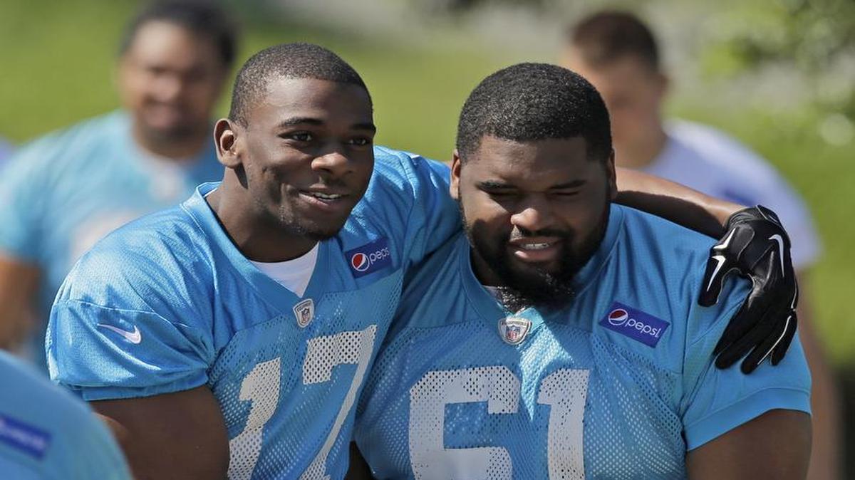 Carolina Panthers' Devin Funchess (17) jokes with Zach Allen (61) as they walk to a practice at the NFL football team's rookie minicamp in Charlotte, N.C., Friday, May 8, 2015. (AP Photo/Chuck Burton)