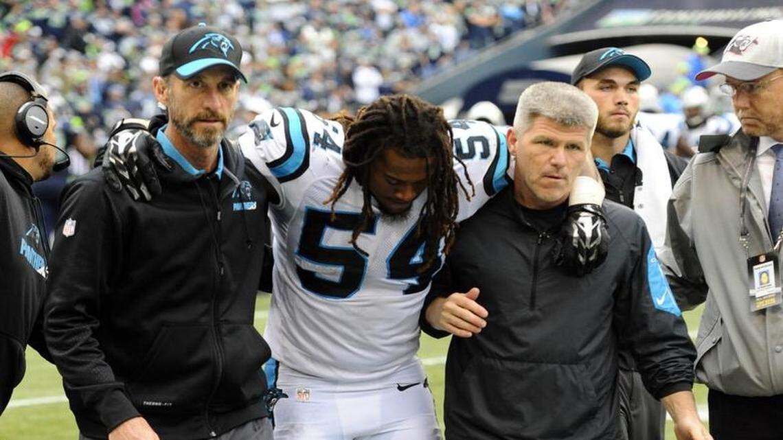 
Carolina Panthers rookie linebacker Shaq Thompson (54) is helped off the field after being injured on a kickoff during the fourth quarter on Sunday. 
