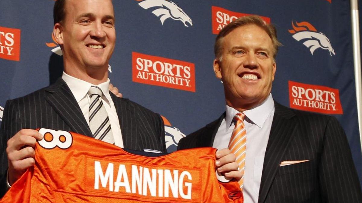 Broncos general manager John Elway (right) needed a rebuilt defense to complement quarterback Peyton Manning (left).