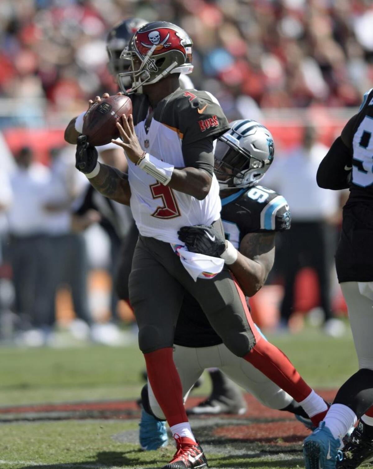 Carolina Panthers defensive end Julius Peppers (90) sacks and causes Tampa Bay Buccaneers quarterback Jameis Winston (3) to fumble during the second quarter on Sunday. The Panthers recovered.