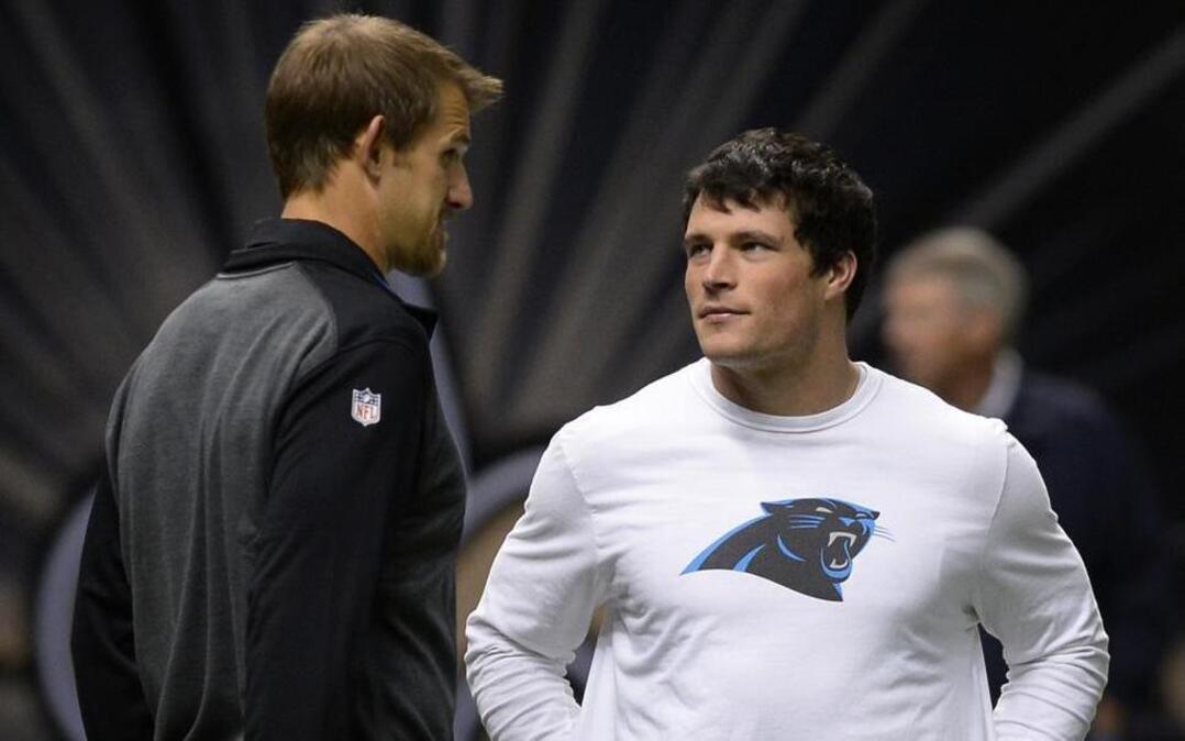 Former Carolina Panthers offensive tackle Jordan Gross (left) is leaving the franchise’s broadcast team to spend more time with his wife and school-age boys.
