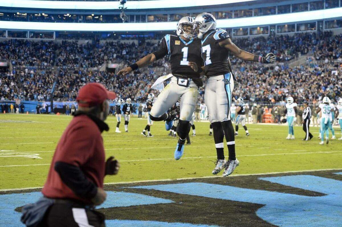 Carolina Panthers quarterback Cam Newton (1) and wide receiver Devin Funchess (17) celebrate a touchdown against the Miami Dolphins in the second quarter of a “Monday Night Football” game at Bank of America Stadium in 2017. The Panthers won, 45-21, with Newton throwing for four touchdowns.