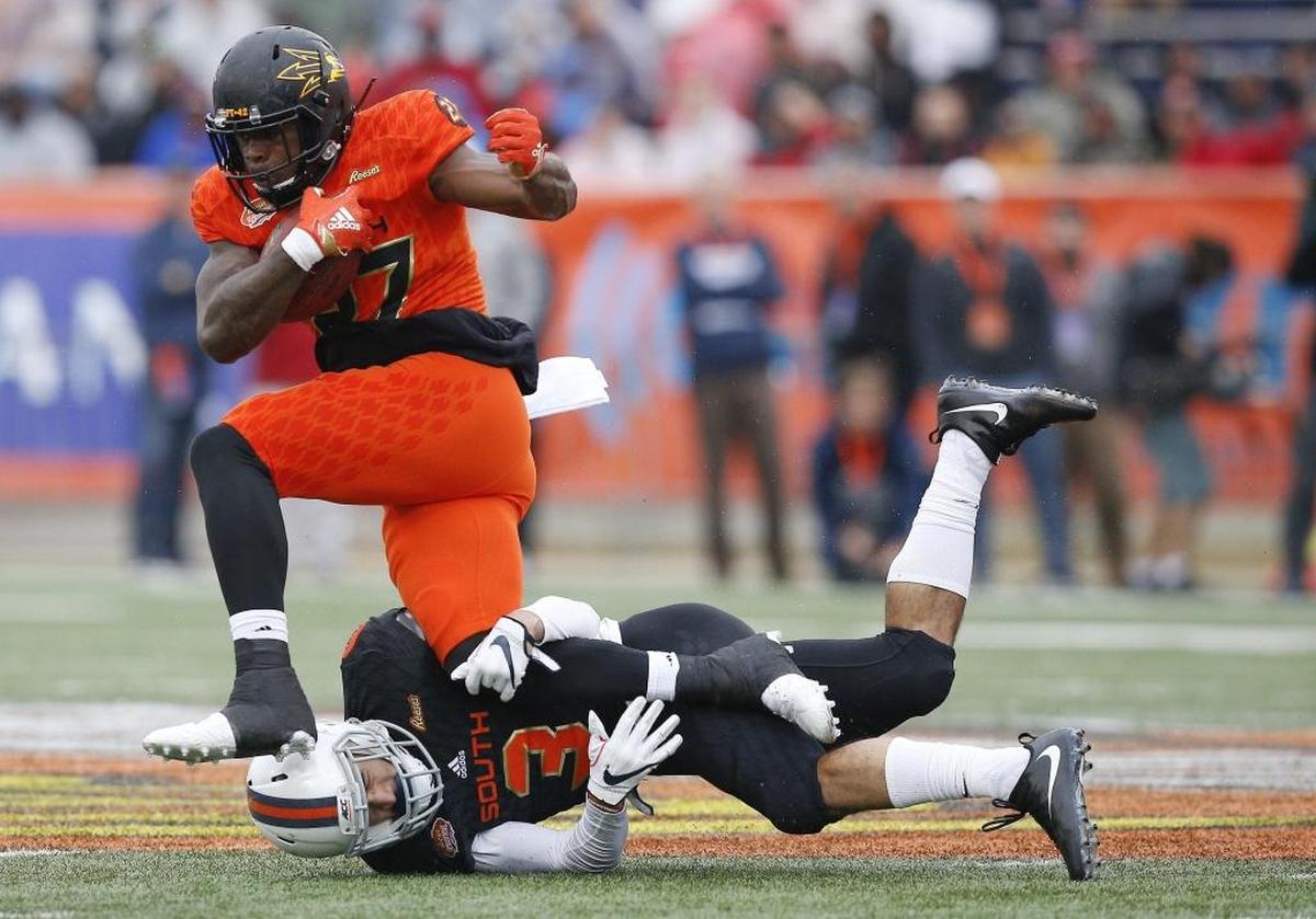 Arizona State running back Kalen Ballage, shown breaking a tackle in the Senior Bowl, is the type of big, physical back the Panthers need to replace Jonathan Stewart.