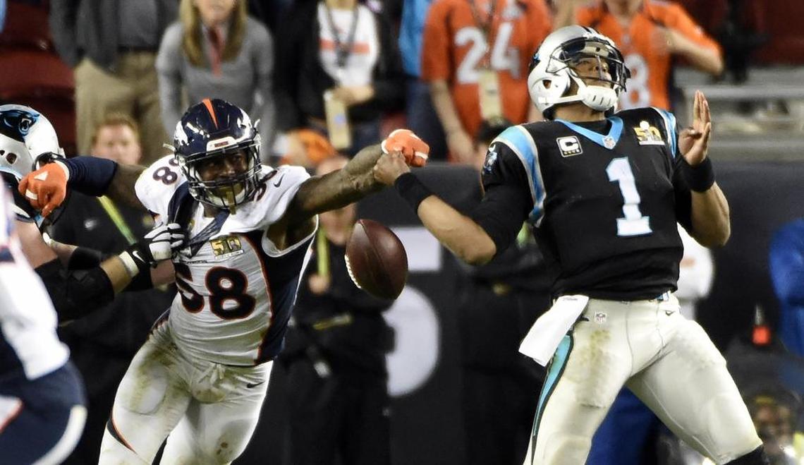 Denver Broncos outside linebacker Von Miller (58) strips the ball from Carolina Panthers quarterback Cam Newton (1) in the fourth quarter of Super Bowl 50. The Broncos won, 24-10, on Feb. 7, 2016.