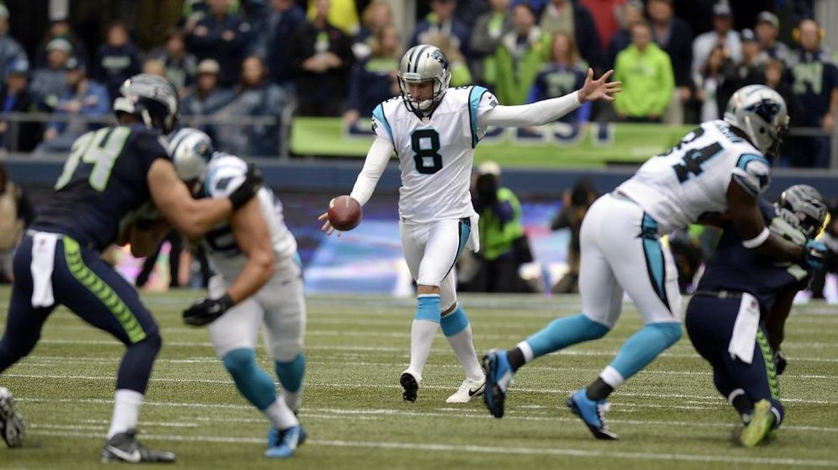 Carolina Panthers' Brad Nortman (8) punts to the Seattle Seahawks in the first half at CenturyLink Field on Sunday, October 18, 2015. The Panthers won, 27-23.