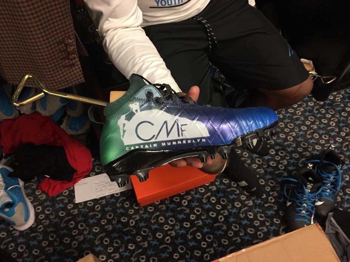 The customized cleats Carolina Panthers cornerback Captain Munnerlyn will wear on Sunday in New Orleans feature his foundation, which supports his annual football camp in his hometown of Mobile, Ala., a holiday toy giveaway and the March of Dimes.