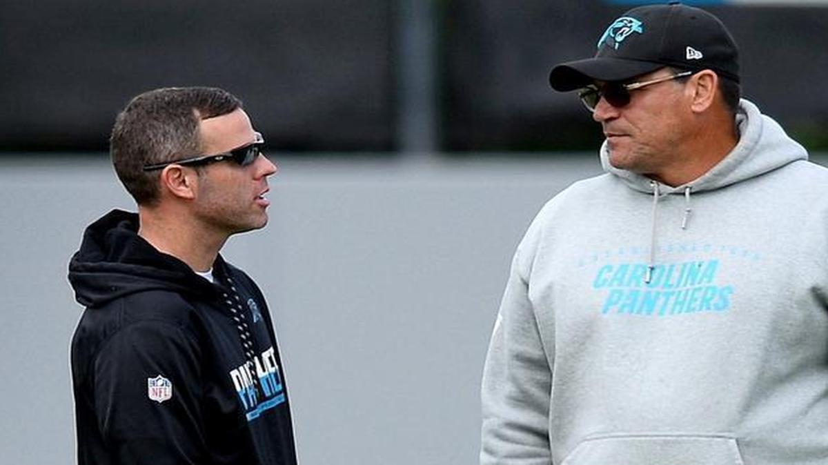 Carolina Panthers assistant general manager Brandon Beane, left, and head coach Ron Rivera talk during the team’s rookie minicamp on Friday. On Tuesday, Beane was hired to be the Buffalo Bills’ general manager.