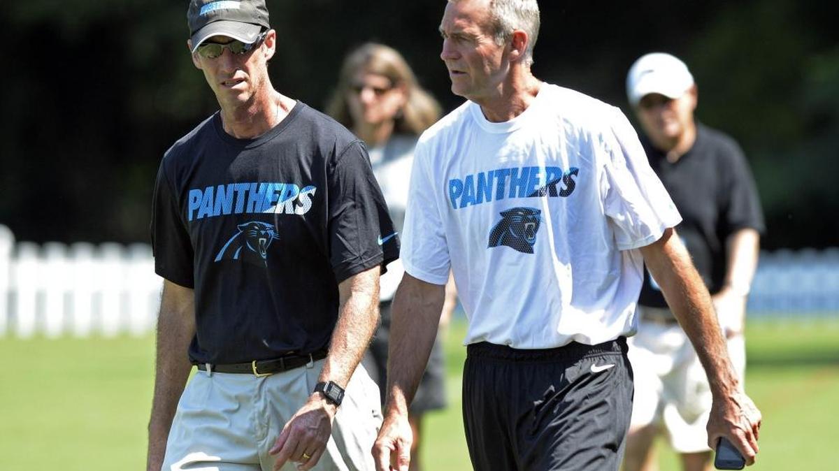 
Carolina Panthers' head athletic trainer Ryan Vermillion, left, and Dr. Robert Anderson leave the field after morning practice at Carolina Panthers training camp Aug. 12.
