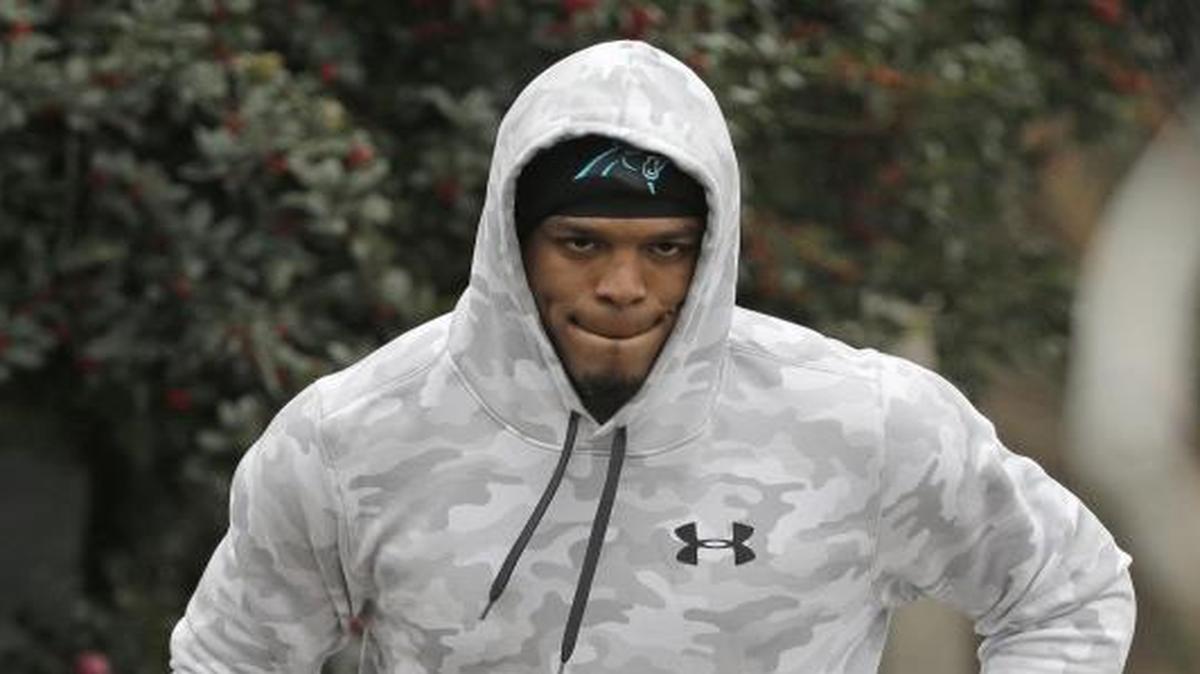 Carolina Panthers quarterback Cam Newton came to practice Friday dressed in cut-off football pants and ‘recovery stockings,’ he said.