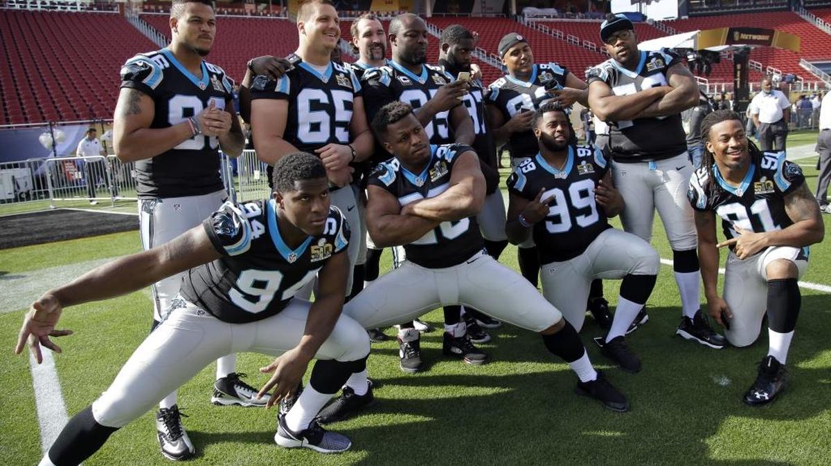 Members of the Carolina Panthers pose for photos inside Levi's Stadium as they gathered Saturday for a team photo in preparation for Super Bowl 50 in Santa Clara, Calif.