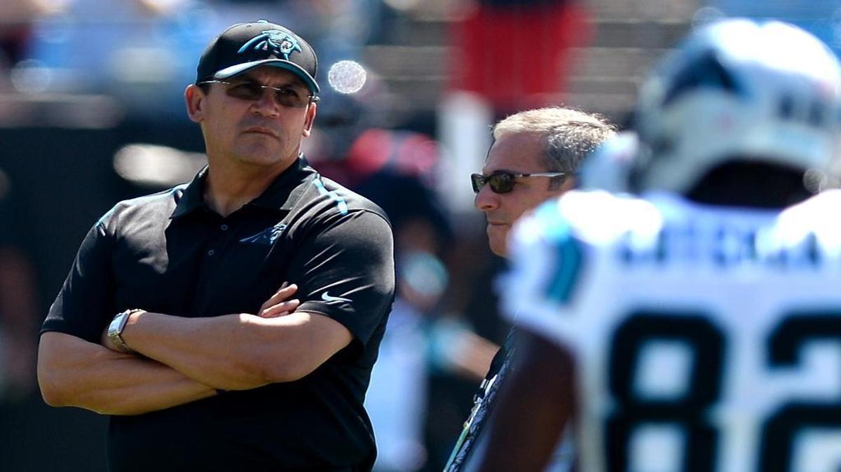 
Carolina Panthers head coach Ron Rivera, left, stands with the team's general manager Dave Gettleman, center, as the team prepares to play the Houston Texans on Sunday.
