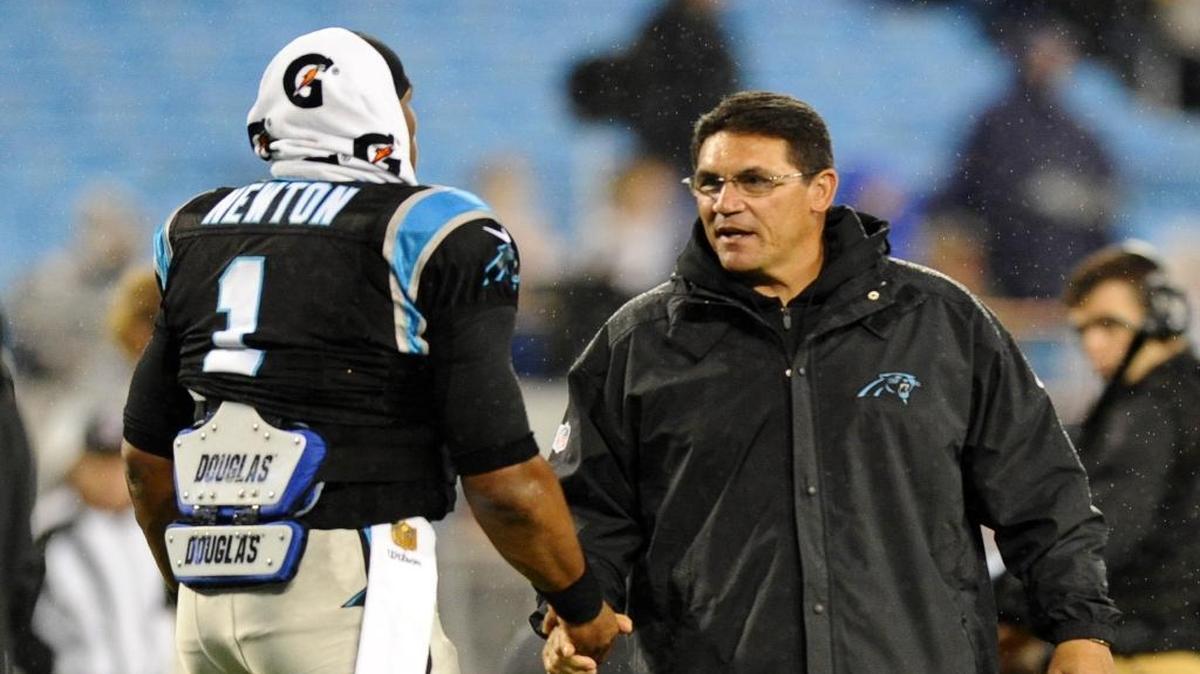 Carolina Panthers coach Ron Rivera, right, greets quarterback Cam Newton before Monday night’s game against the Indianapolis Colts.