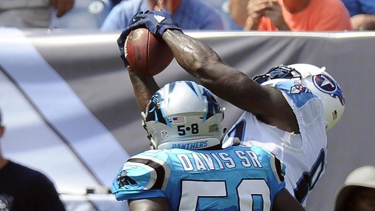 Tennessee Titans tight end Delanie Walker (82) makes a touchdown catch as Carolina Panthers outside linebacker Thomas Davis (58) closes in during Saturday’s game. “We hold ourselves to a higher standard than the way we played today,” Davis said after the game in Nashville.