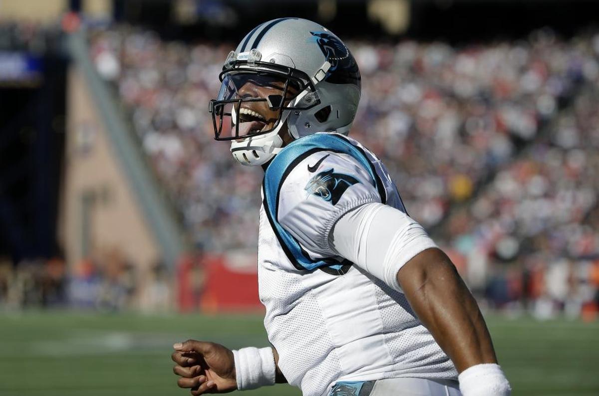 Carolina Panthers quarterback Cam Newton celebrates his touchdown pass to Devin Funchess during the second half of Sunday’s NFL game against the New England Patriots in in Foxborough, Mass. The Panthers won 33-30.