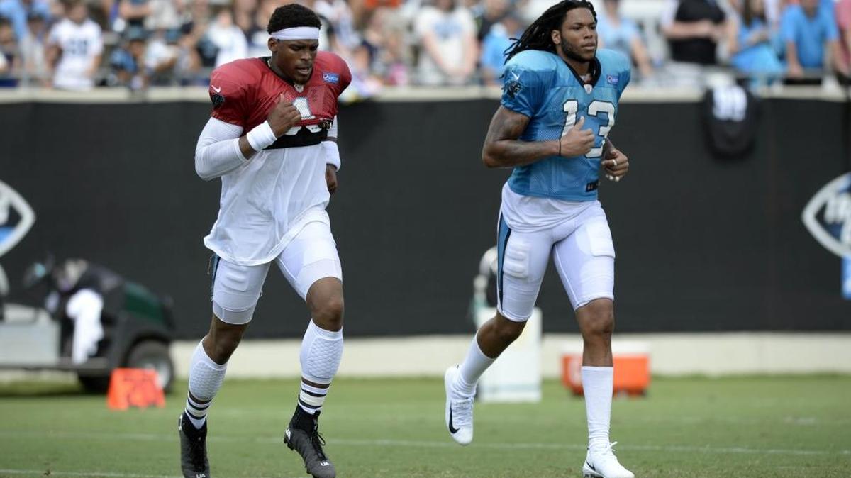 Carolina Panthers quarterback Cam Newton (1) and wide receiver Kelvin Benjamin (13) run near the end of practice during training camp at Wofford College in Spartanburg, SC on Saturday, August 12, 2017.
