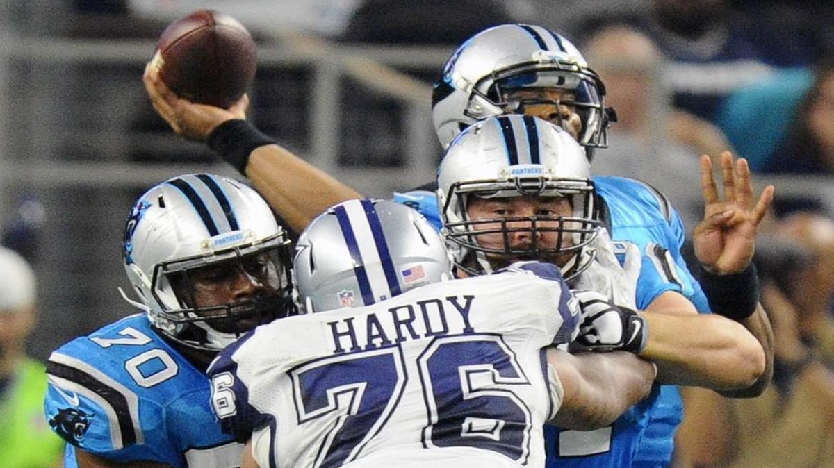 The Carolina Panthers, including Trai Turner (70) and Ryan Kalil (67), stymied Dallas defensive end and former teamate Greg Hardy (76) all day Thursday, holding him without a tackle or a sack.