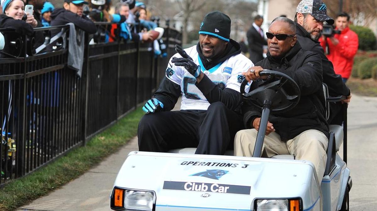 Carolina Panthers linebacker Thomas Davis, left, waves to fans as he leaves practice on Wednesday. Davis didn’t participate and wasn’t made available to reporters.