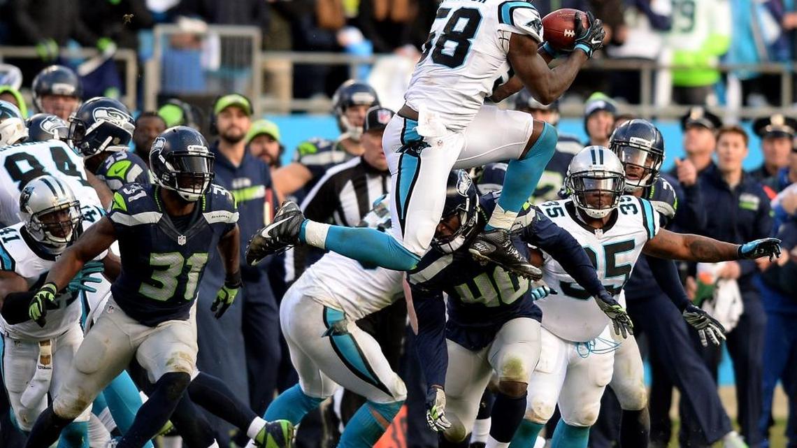Carolina Panthers linebacker Thomas Davis recovers an onside kick by the Seattle Seahawks late in the fourth quarter of Carolina’s 31-24 victory.