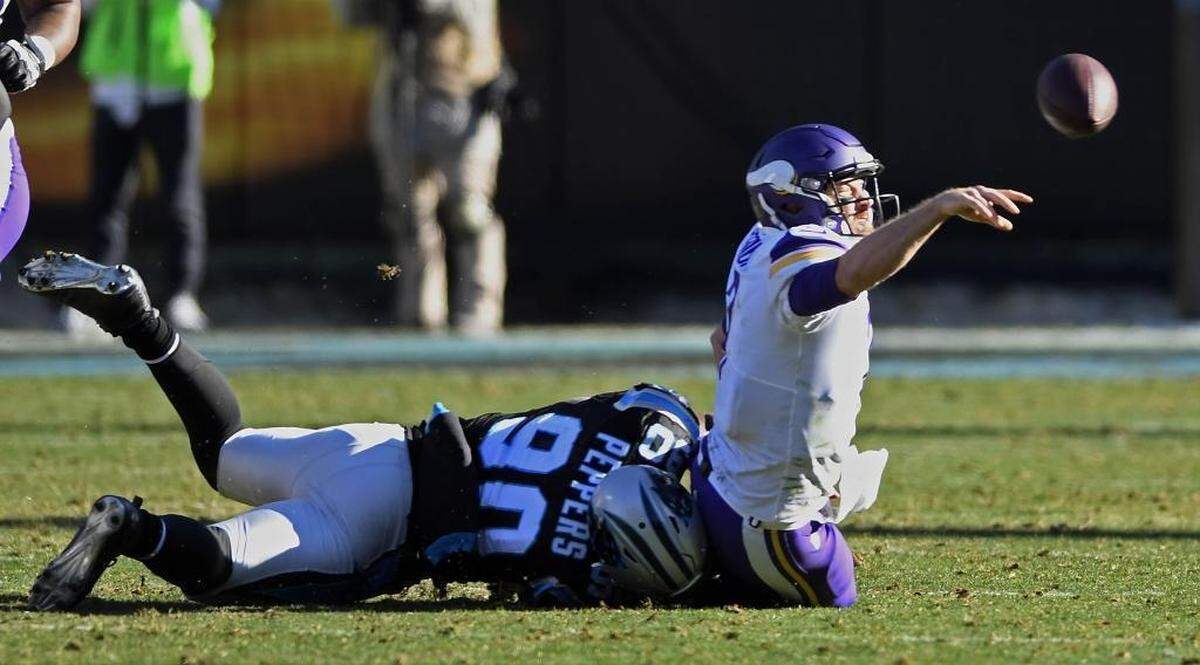 Carolina Panthers defensive end Julius Peppers (90) sacked Minnesota Vikings quarterback Case Keenum (7) in the first half to take the team lead in sacks with 9.5.
